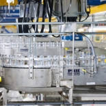 Line of cans in a manufacturing machine