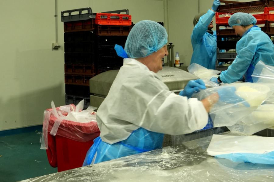 Manufacturing workers at Picnic Foods facility preparing products