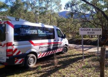 Health Select patient transport vehicle next to Suggan Buggan River sign