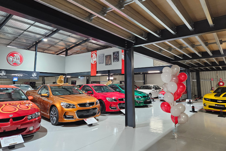 A group of different model and colour Holdens in the new showroom.