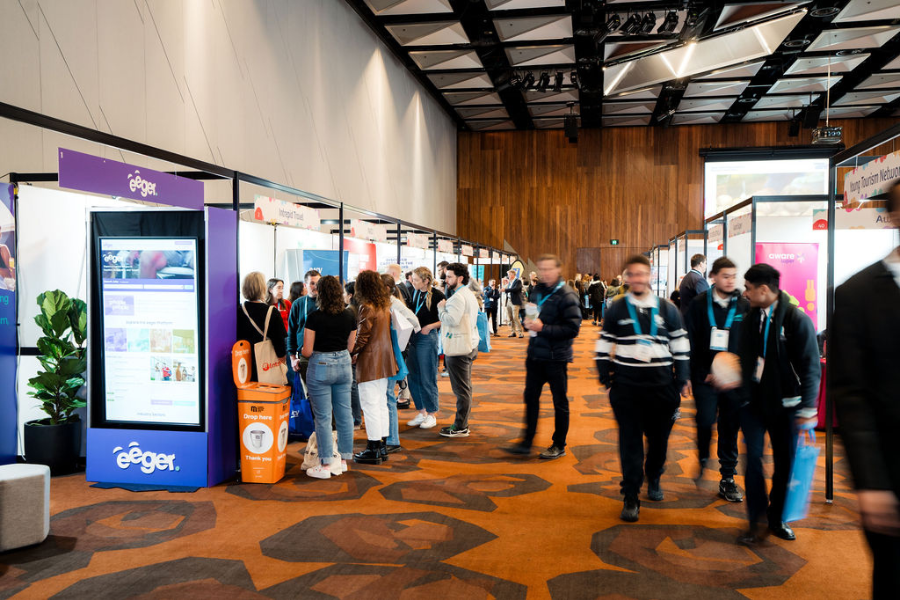 Attendees visiting exhibition stands. 