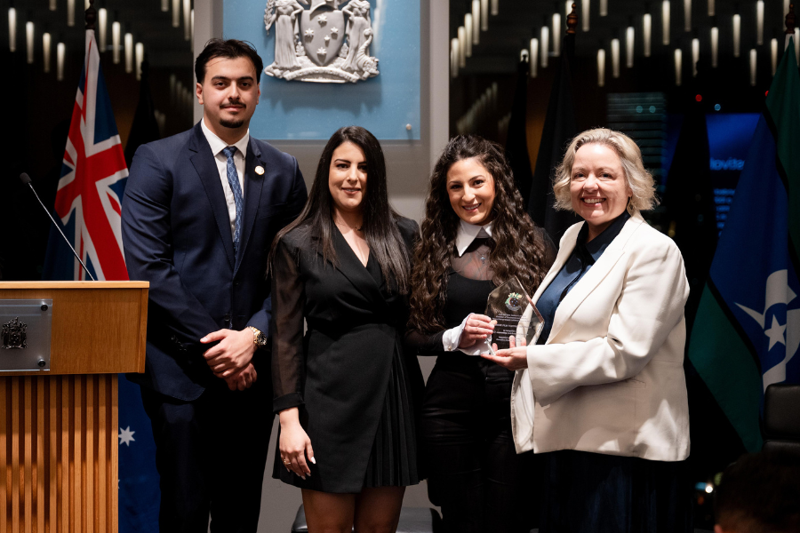 People accepting award on stage from ANLCCI You Entrepreneurs and the Lebanese Film Festival Australia