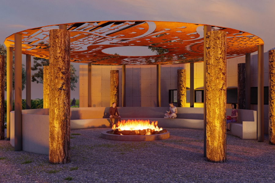 Rendering of the outdoor seating area at Yorta Yorta Cultural Centre at twilight featuring a central fire pit surrounded by wooden pillars and an ornate metal canopy with abstract designs. Several people are seated around the fire, enjoying the warm ambience.