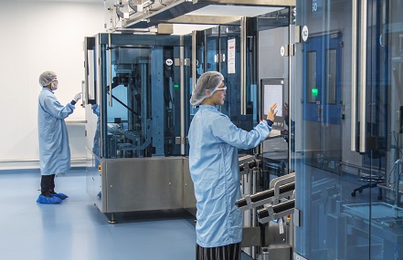 Photo of two laboratory workers in a lab