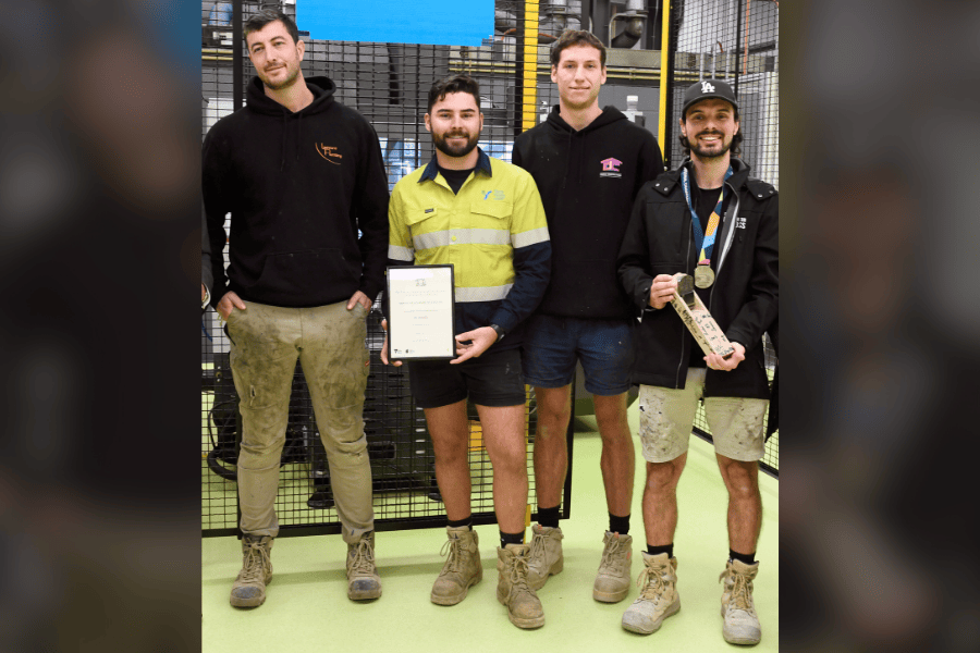 Luca Mascaro, Lucas Heritage and 2 other individuals posing with trade papers