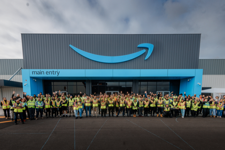 Amazon staff standing outside the front of the new fulfilment centre in melbourne