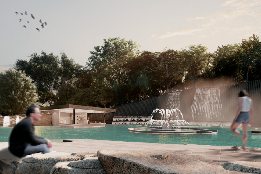 Phillip Island Hot Springs A serene outdoor scene featuring a calm swimming pool with a central fountain, surrounded by lush greenery and trees. Two blurred figures are near the pool, with one sitting and the other walking. A pool bar in the distance.