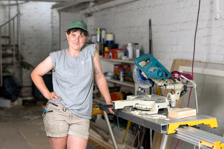  Natasha Eastman-Nagle Carpenter standing casually in their workshop.