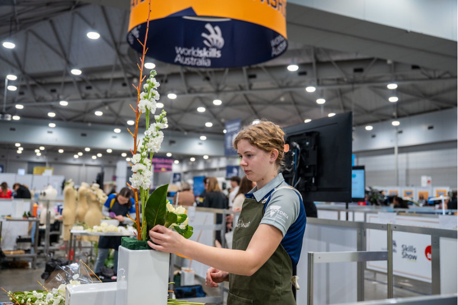 Elisabeth working on a floral piece