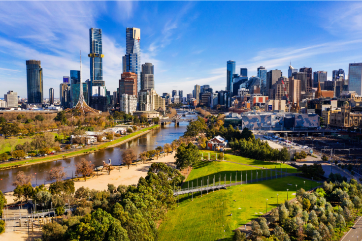 Cityscape of Melbourne CBD with Yarra River in foreground.