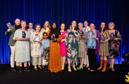 Award winners gathered together on the stage