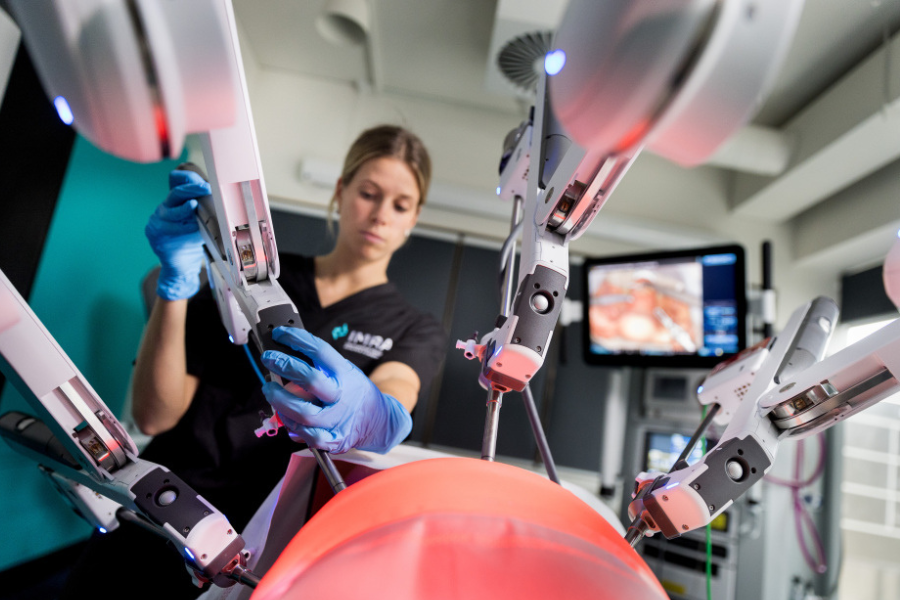 Medical professional using specialist equipment. View is from the perspective of the patient.